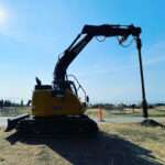 Auger drilling hole in ground